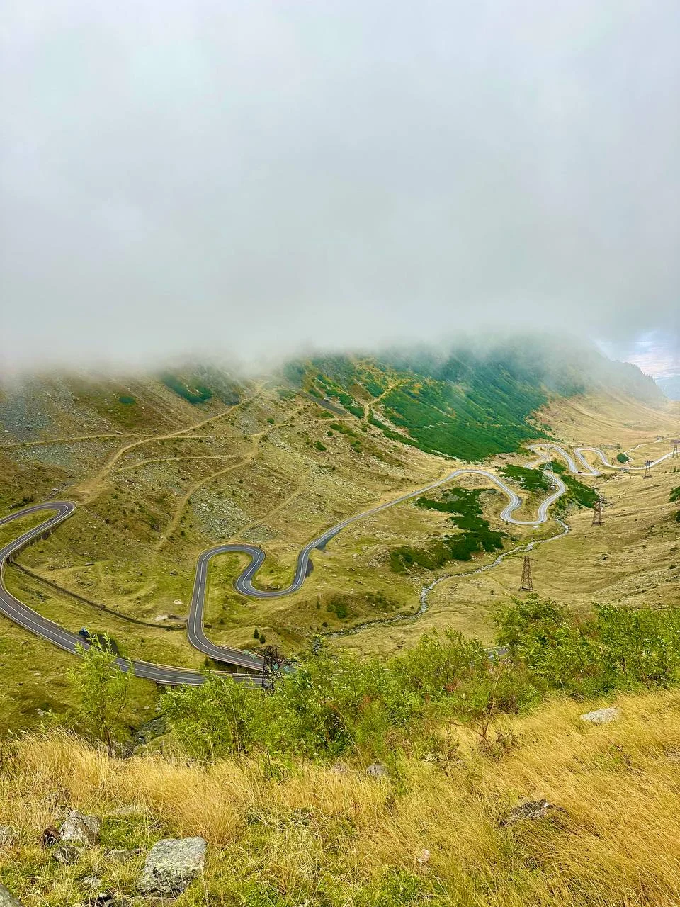 Hairpin bends below clouds on the northern Transfăgărășan